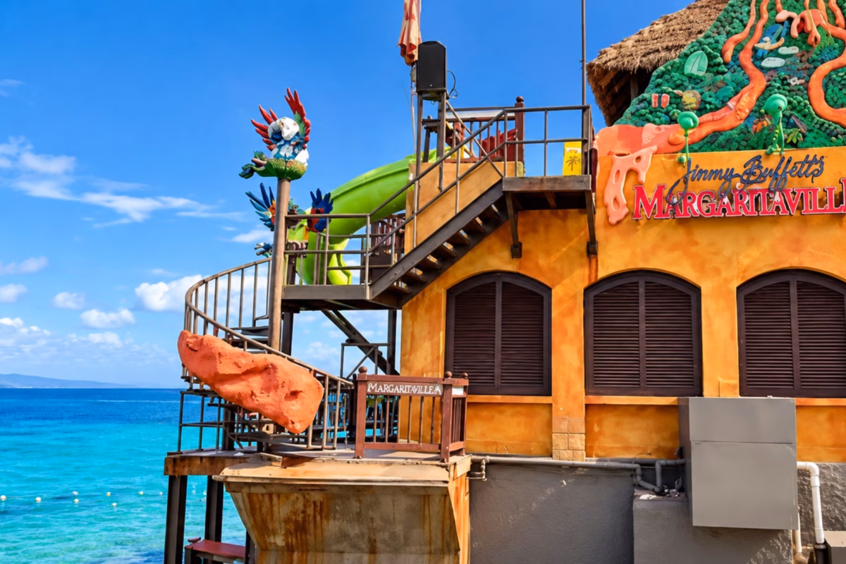 Margaritaville building with a water slide above turquoise sea in Montego Bay