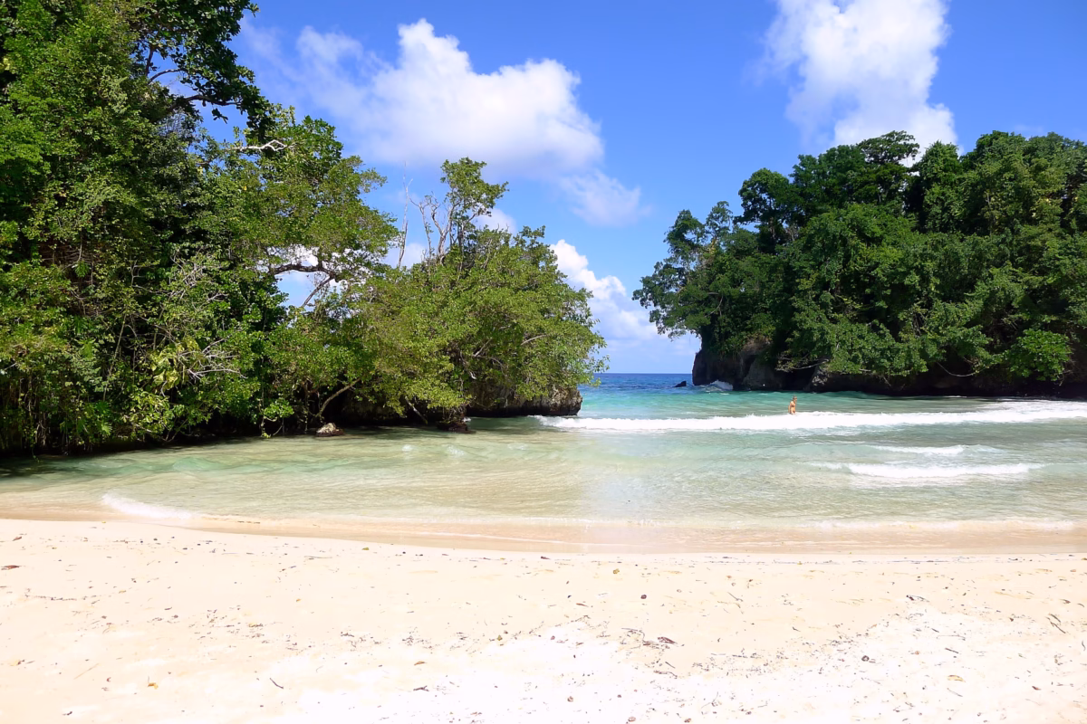 Frenchman's Cove beach with white sand and green islets