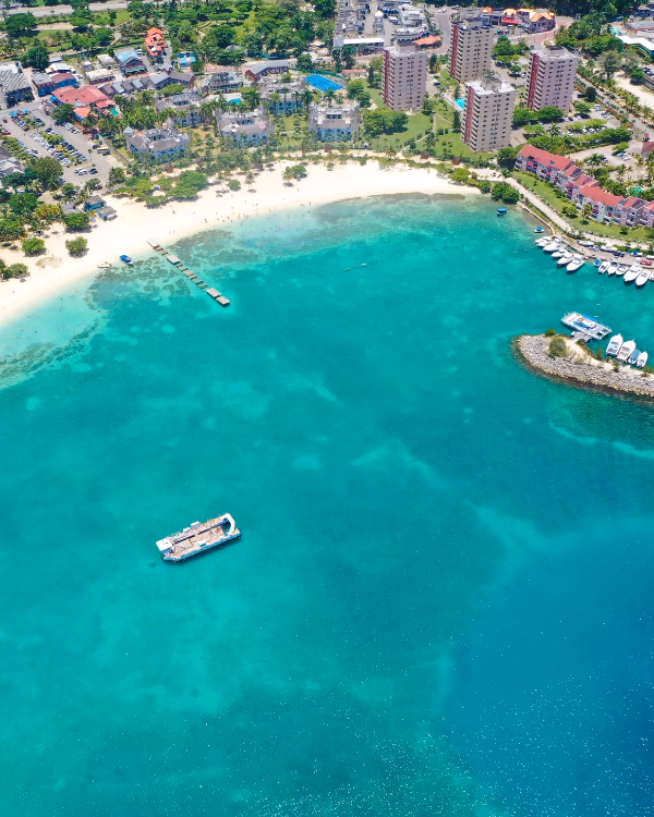 Aerial view of Ocho Rios Bay, Jamaica, with its white-sand beach and turquoise water